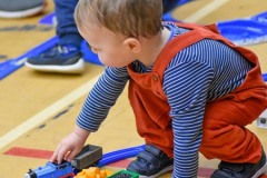Toddler playing trains